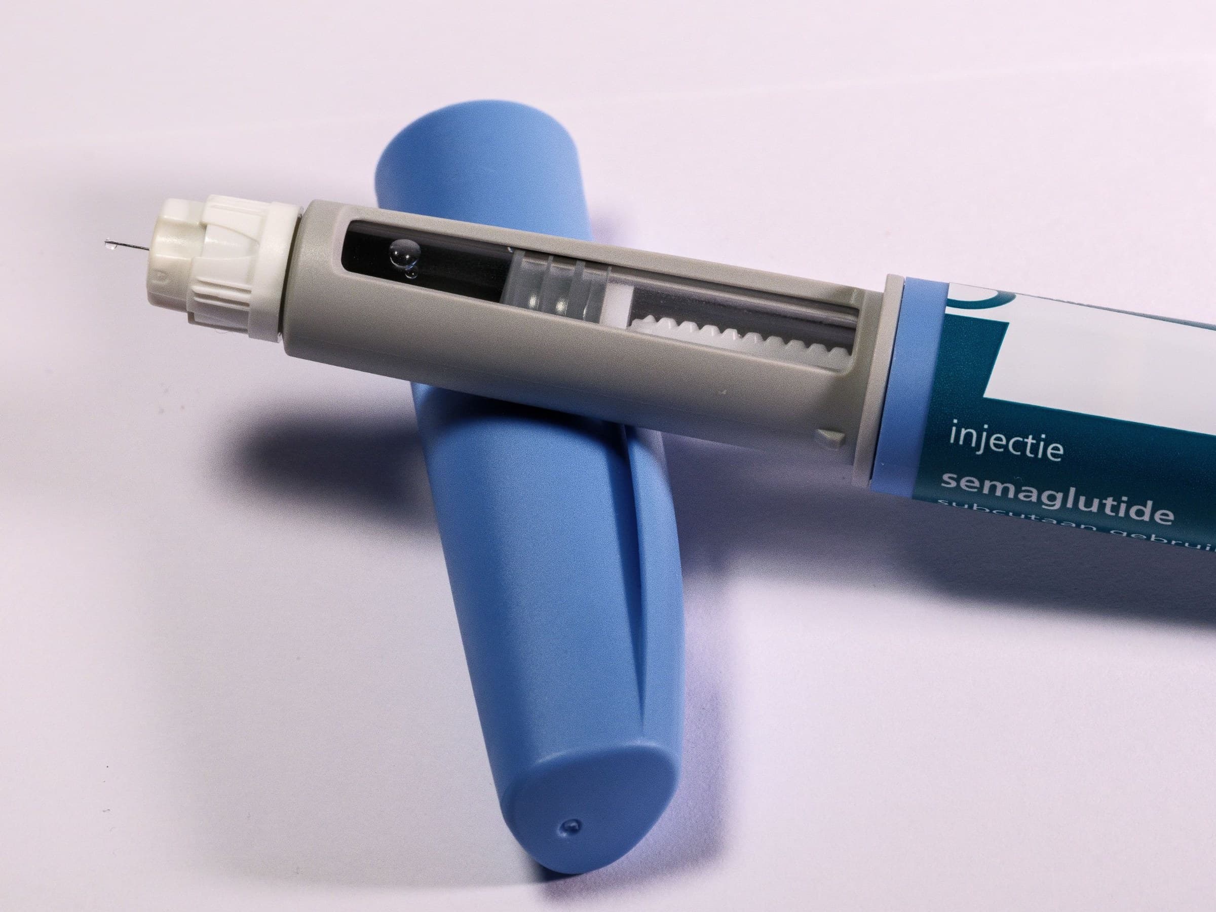 Semaglutide injection pen with its blue cap